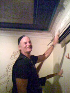 Bill Murray cleaning an AC unit at a restaurant in Martha's Vineyard